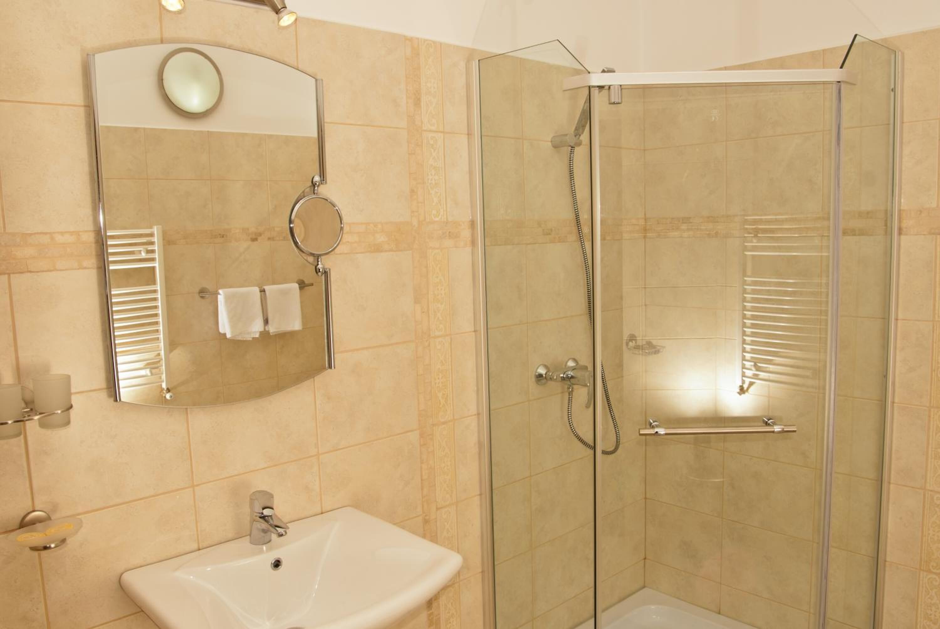 shower, hair dryer, bathrobes, slippers