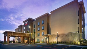 A large, multi-story hotel with a flat roof and a prominent entrance.