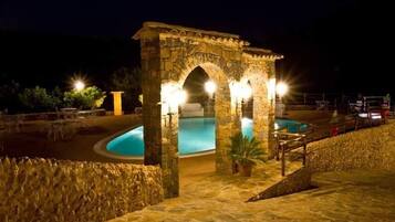 Seasonal outdoor pool, an infinity pool, pool umbrellas, pool loungers
