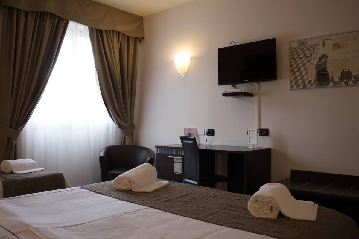 Triple Room, 1 Bedroom | Down comforters, minibar, in-room safe, desk