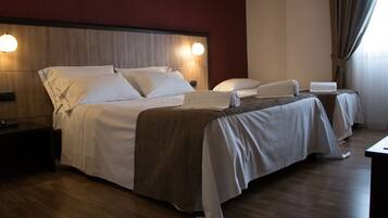 Triple Room, 1 Bedroom | Down comforters, minibar, in-room safe, desk
