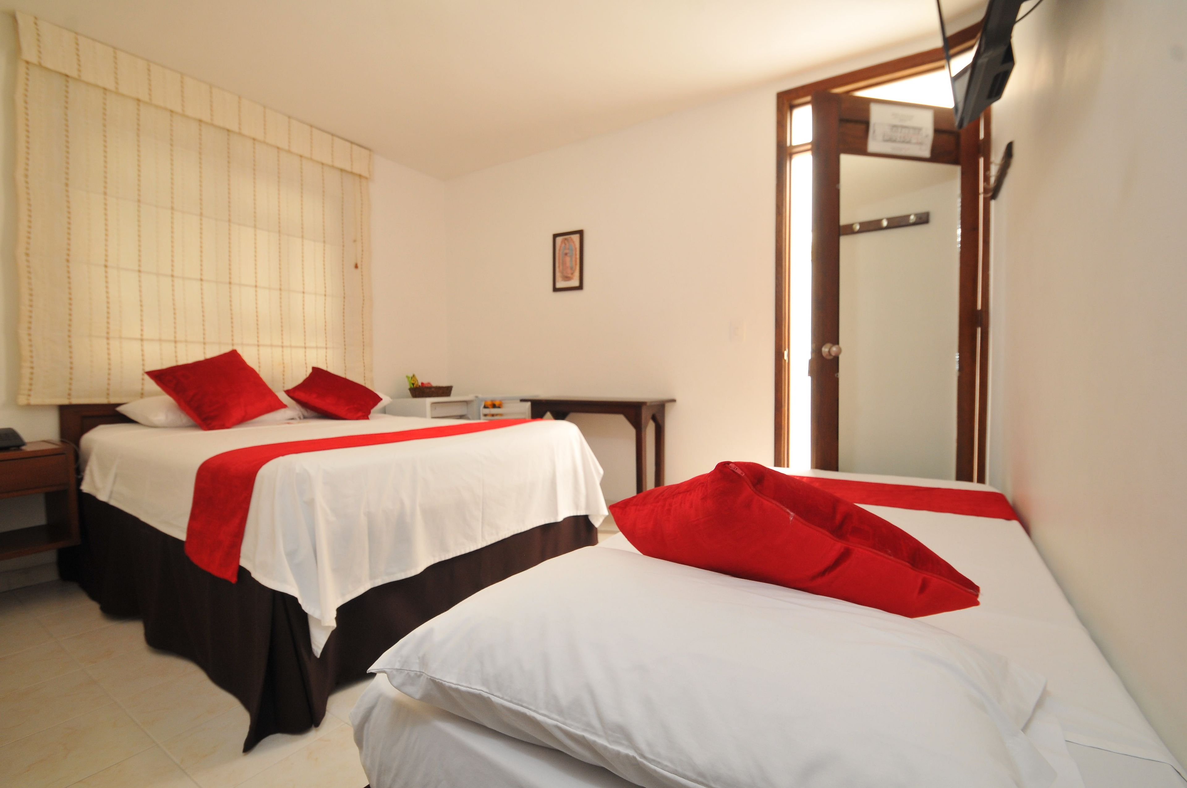 Standard Triple Room | Pillowtop beds, minibar, iron/ironing board, free WiFi