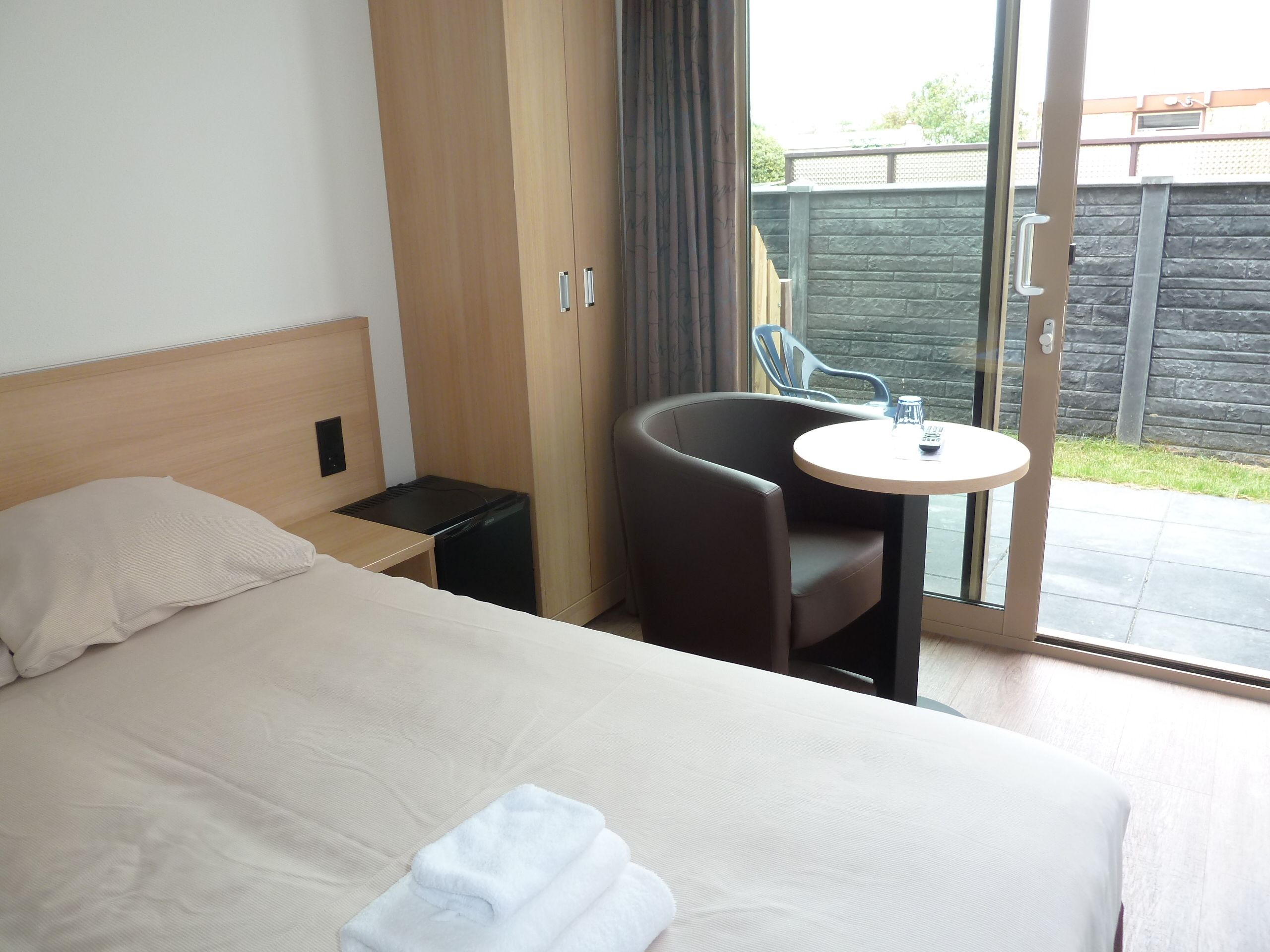 single room, terrace | living area | flat-screen tv