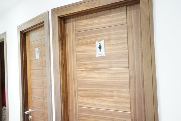 Two wooden doors with a sign indicating a ladies' restroom. - Marlborough Hotel (Liverpool)