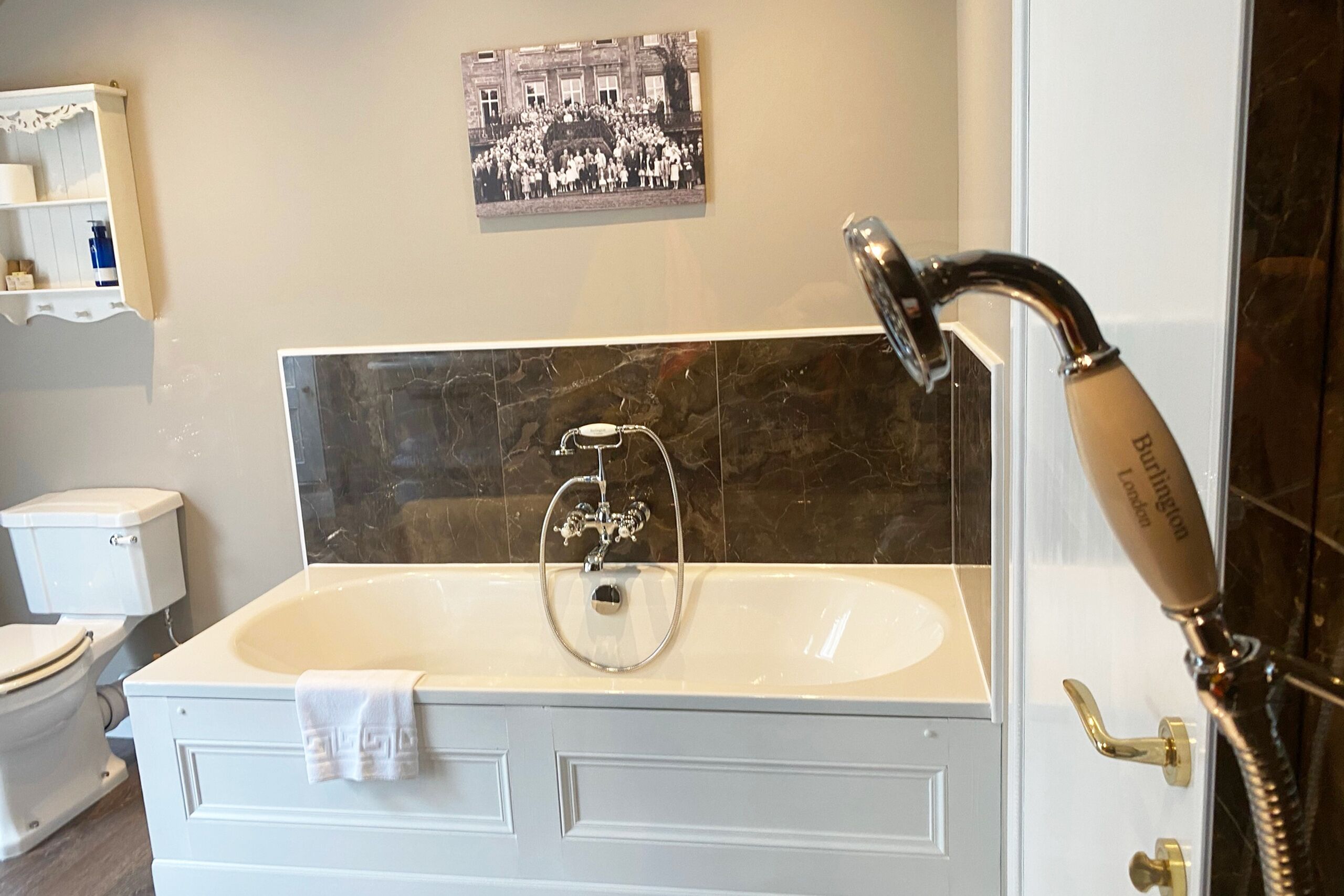 A bathroom with a bathtub, a toilet, a sink, and a shower.
