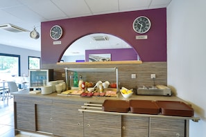 Fresh food and drinks available at this public food station, offering a variety of sandwiches, fruits, and condiments.