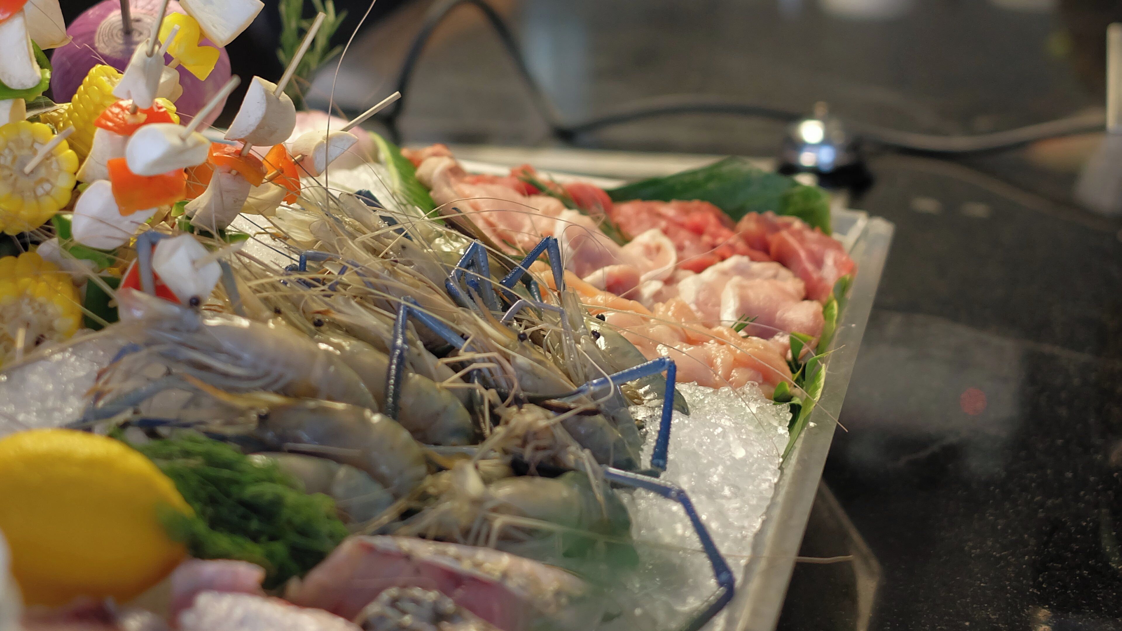 A seafood platter with various types of seafood and vegetables.