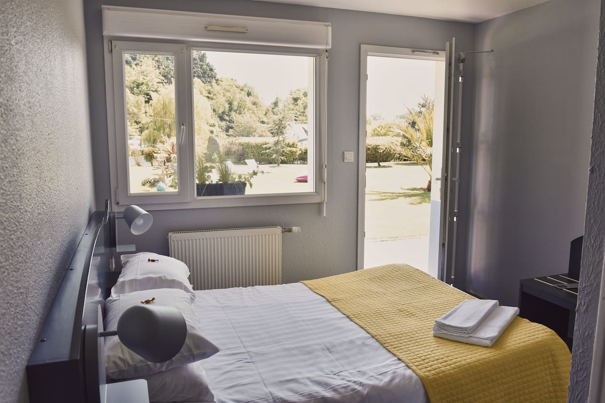 Standard Double Room, Patio, Garden View | Desk, laptop workspace, blackout drapes, soundproofing