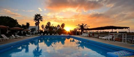 Seasonal outdoor pool, pool umbrellas, pool loungers