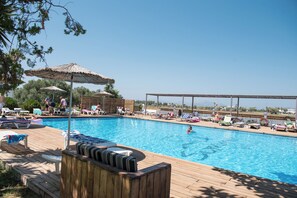 Seasonal outdoor pool, pool umbrellas, pool loungers