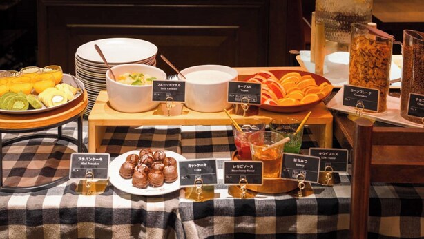 A buffet with various food items including fruit, yogurt, and desserts. - Hotel Resol Ikebukuro (Tokyo)