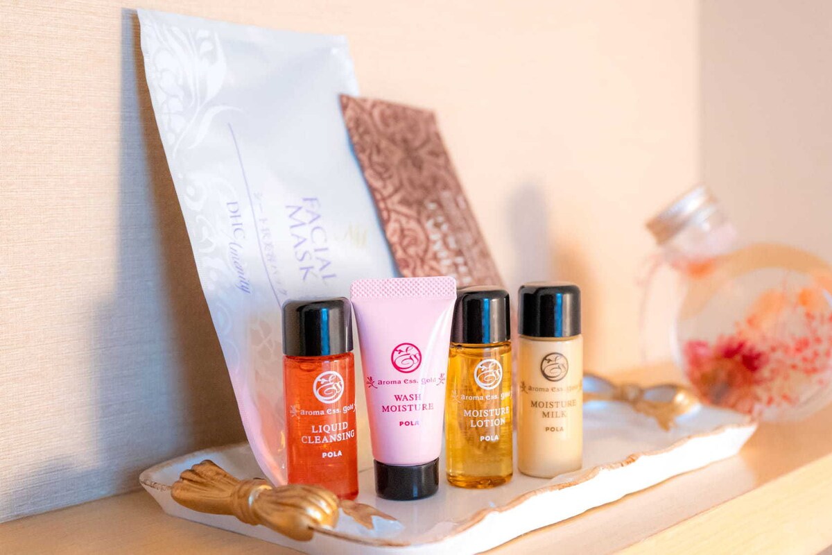 A shelf with skincare products including liquid cleansing, wash, and moisture lotion.