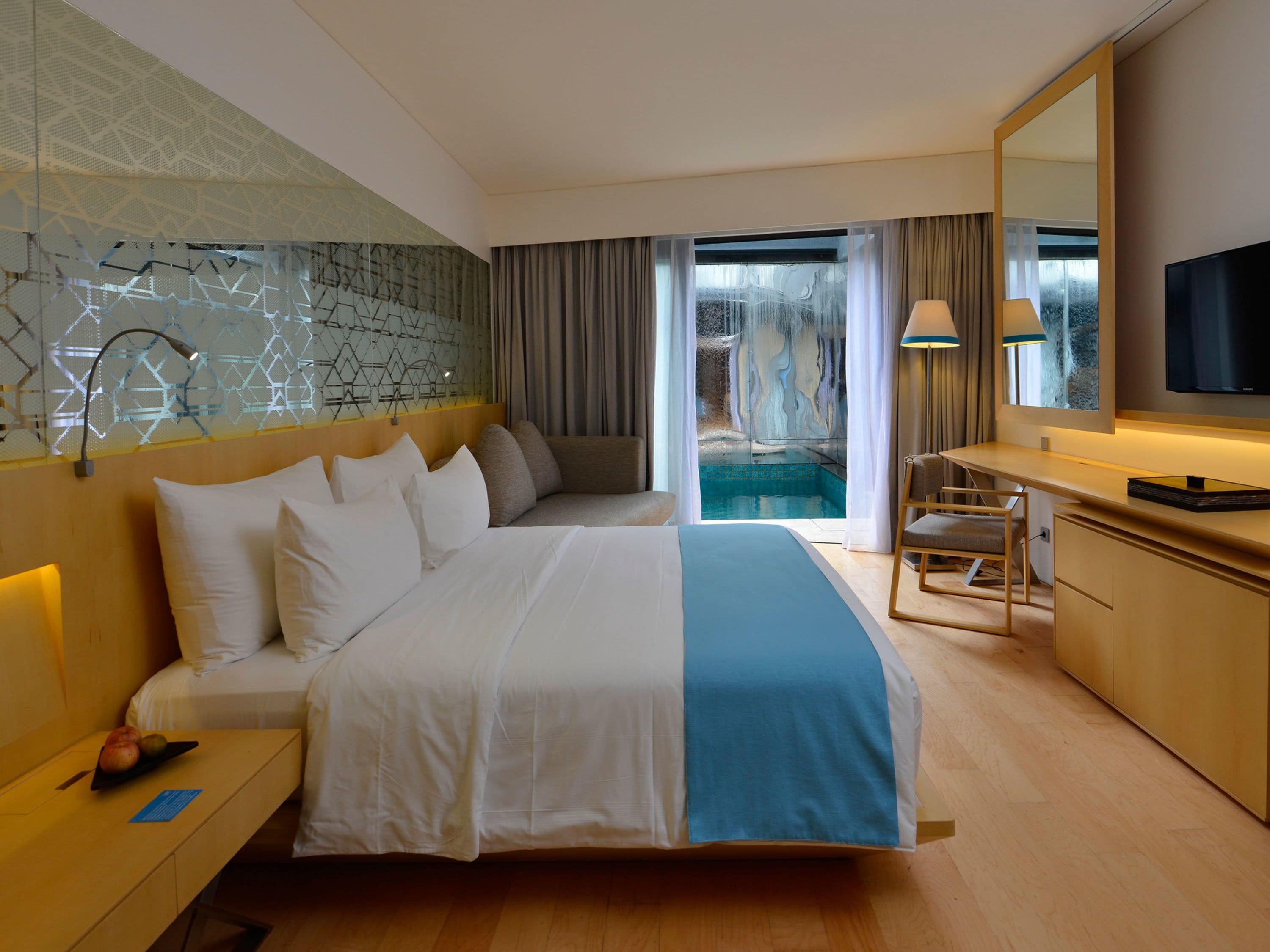 deluxe double room with pool access | premium bedding, pillow-top beds, in-room safe, desk