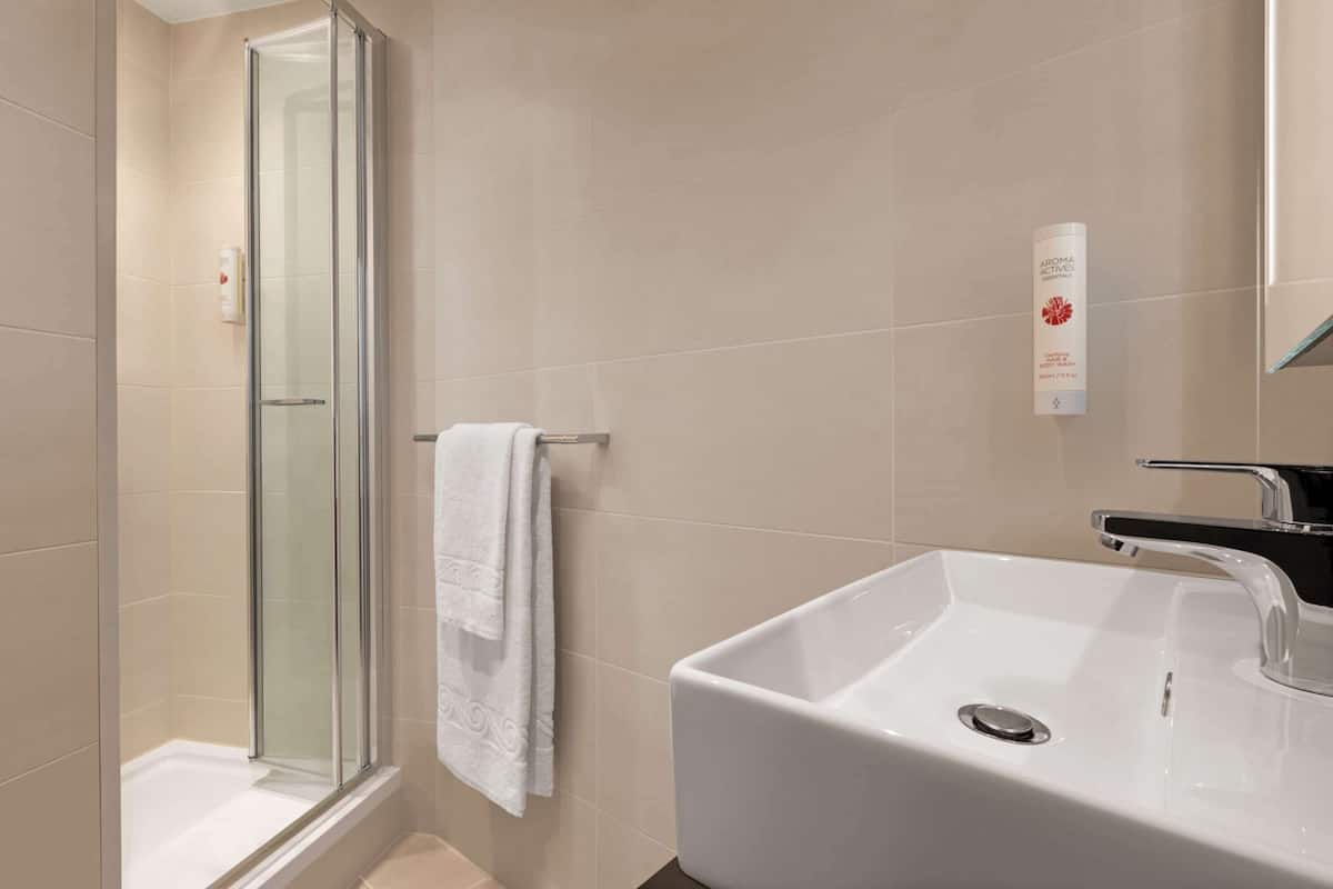shower, eco-friendly toiletries, hair dryer, towels
