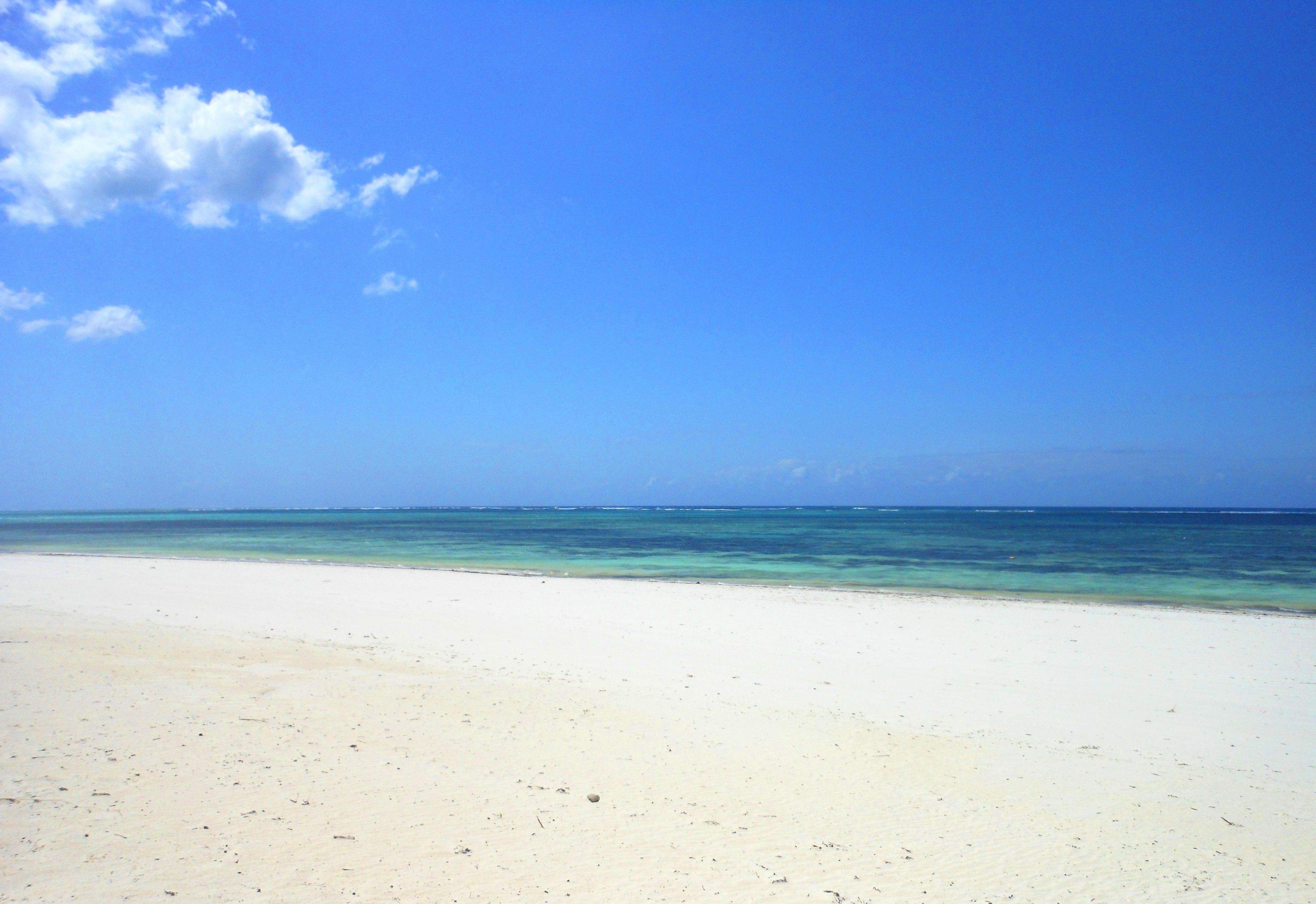 on the beach, white sand, free beach cabanas, sun-loungers