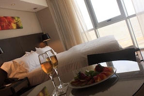 Suite, River View | Pillowtop beds, minibar, in-room safe, iron/ironing board