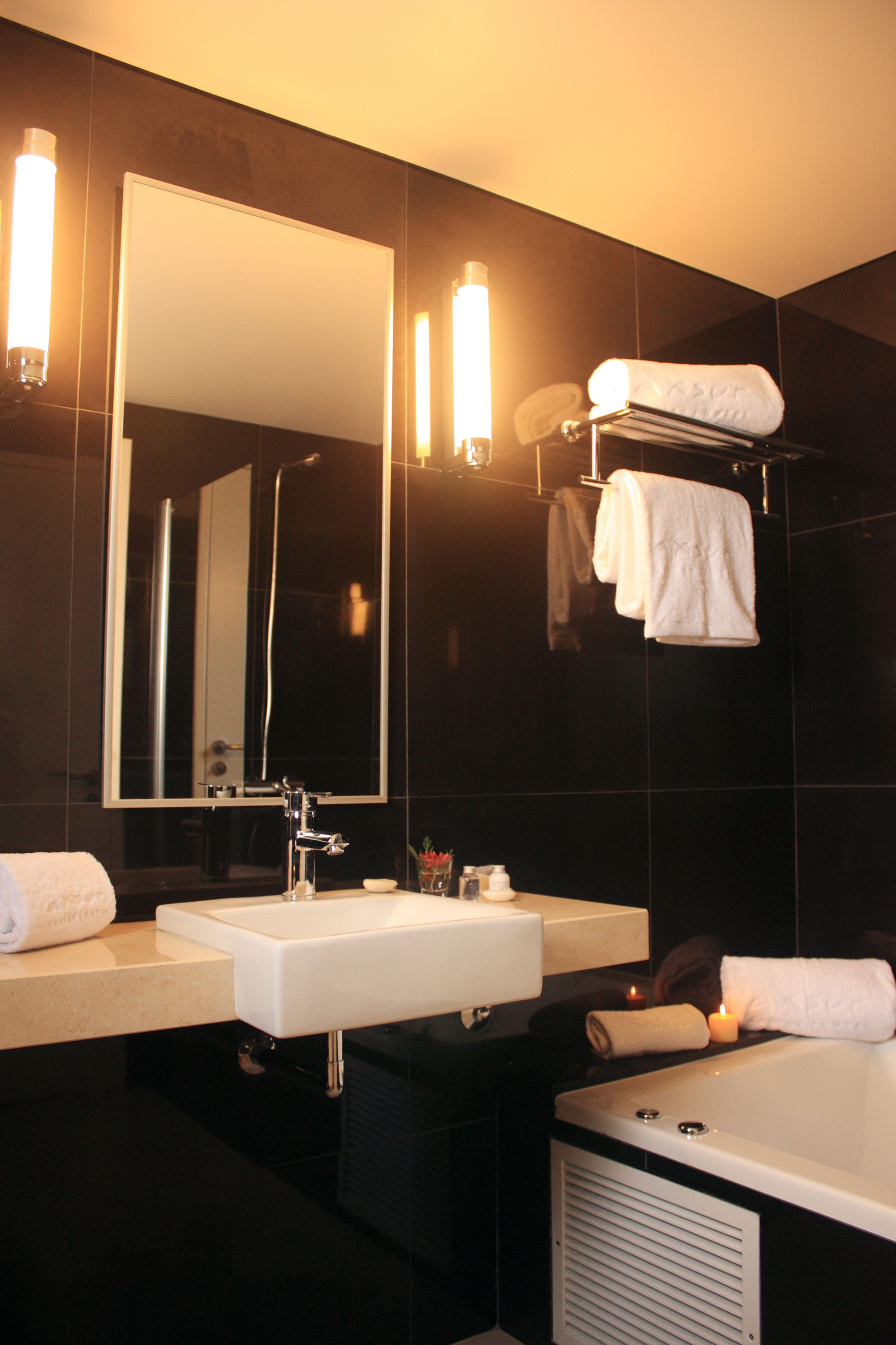 suite, river view | bathroom | rainfall showerhead, designer toiletries, hair dryer, towels