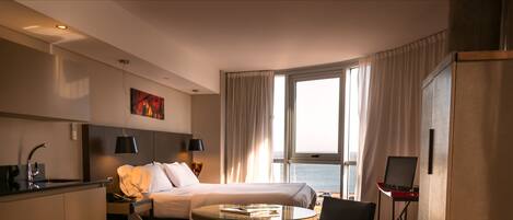 Suite, River View | Pillow-top beds, minibar, in-room safe, iron/ironing board