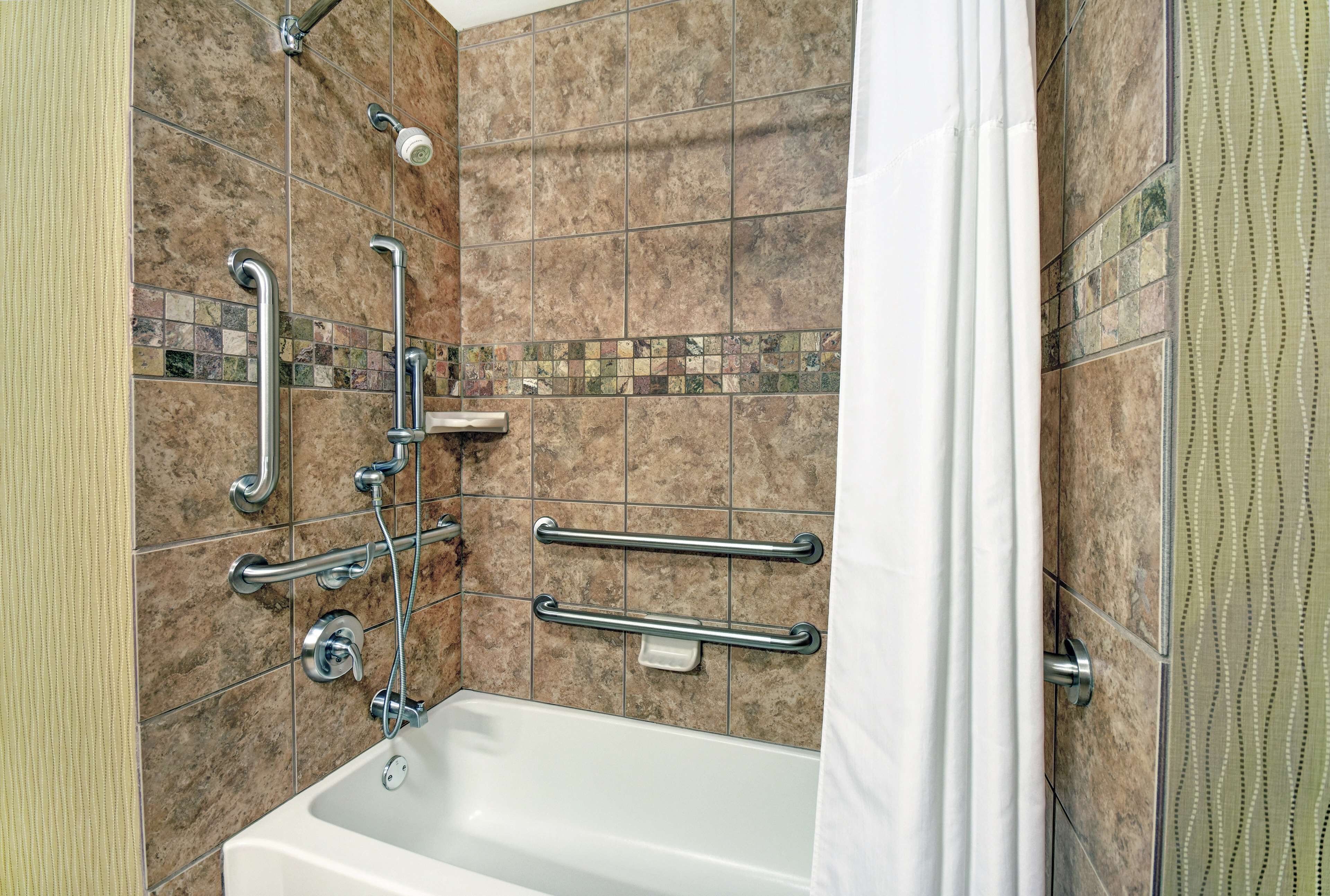 bathtub, hair dryer, towels