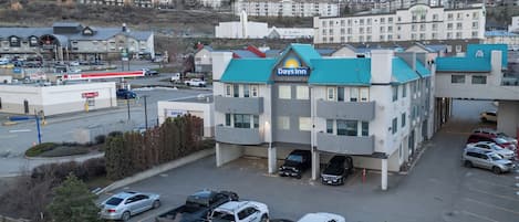 A Days Inn with a modern design, featuring a prominent Days Inn sign on the roof.