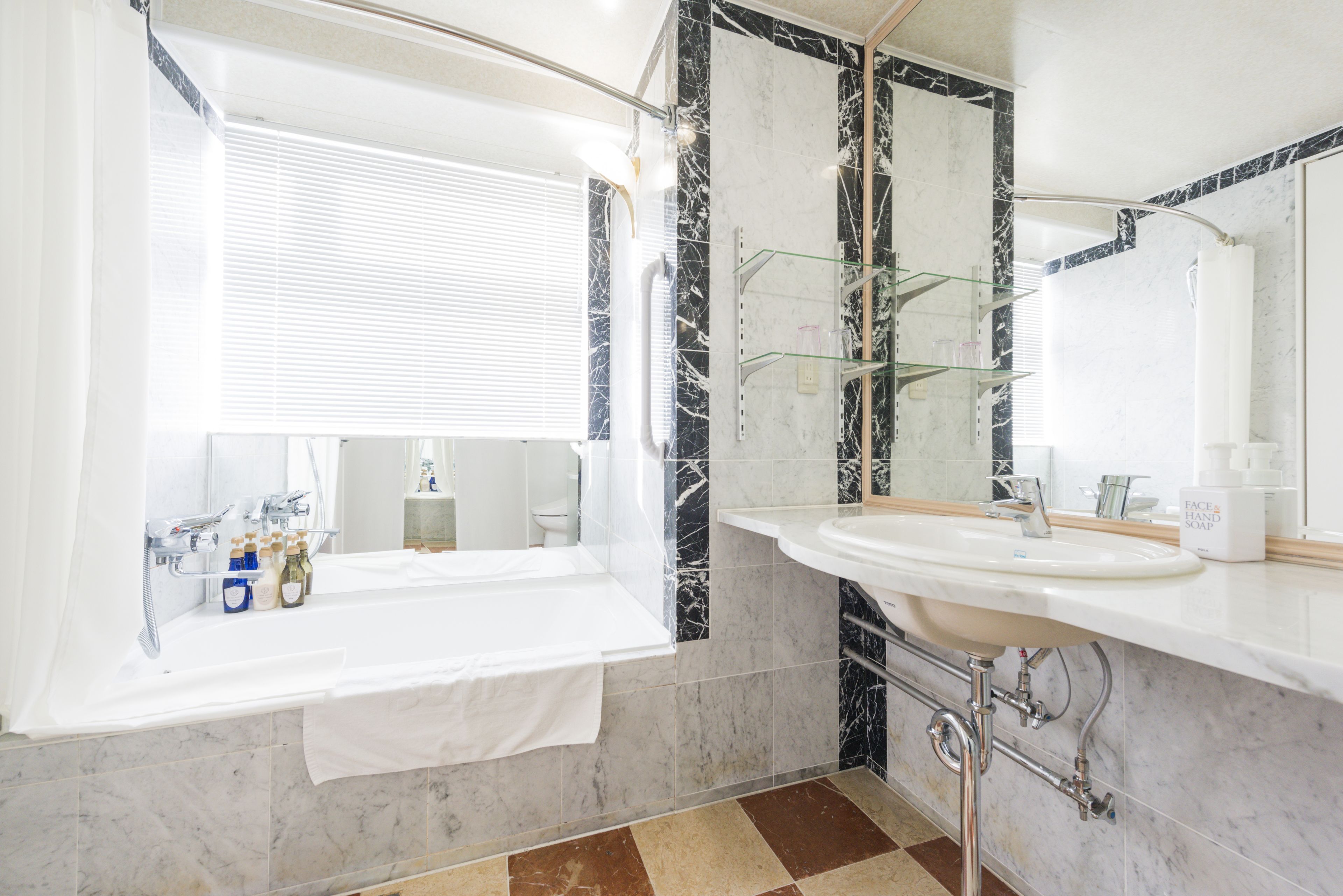 combined shower/bathtub, free toiletries, hair dryer, slippers