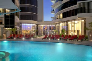 Outdoor pool, open 7:00 AM to 9:00 PM, pool umbrellas, sun loungers