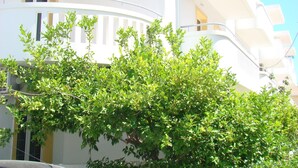 A multi-story building with balconies and air conditioning units. - Diamond Apts and Suites (Hersonissos)