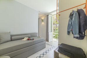 Standaard suite, Meerdere bedden | Een kluis op de kamer, individueel gemeubileerd