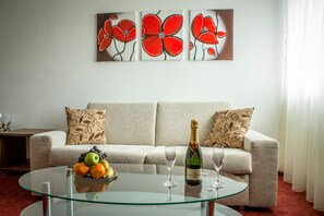 Suite, 2 Bedrooms | Living area | 22-inch LCD TV with cable channels, TV