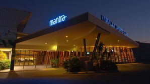 A building with a sign reading "MANILA SPORTS CLUB" and "mantra" above it. - Mantra Gladstone (Barney Point)