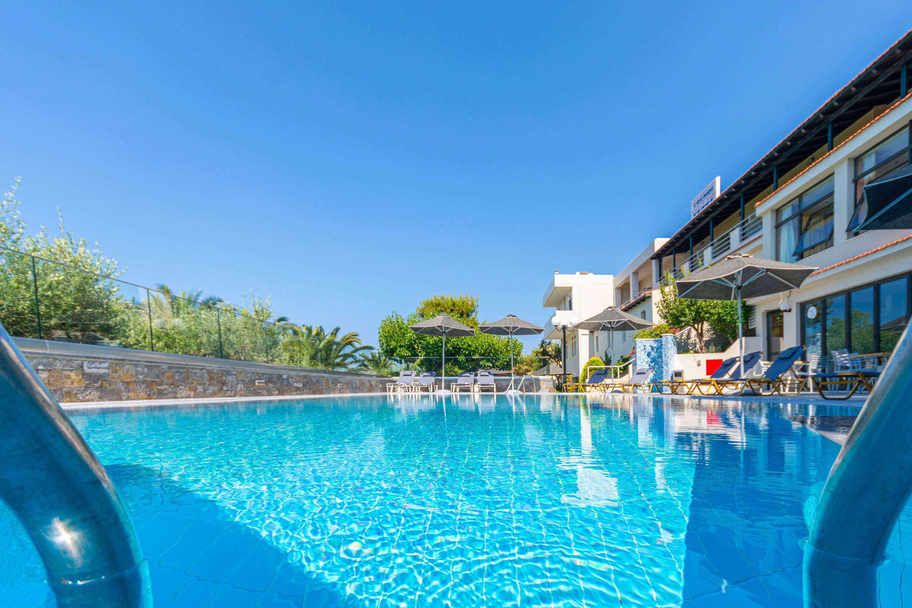 outdoor pool, pool umbrellas, pool loungers