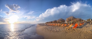 On the beach, sun-loungers, beach umbrellas