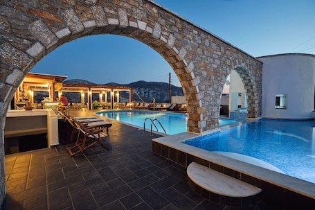 Seasonal outdoor pool, open 9:00 AM to 8:00 PM, pool loungers. Vigla Hotel