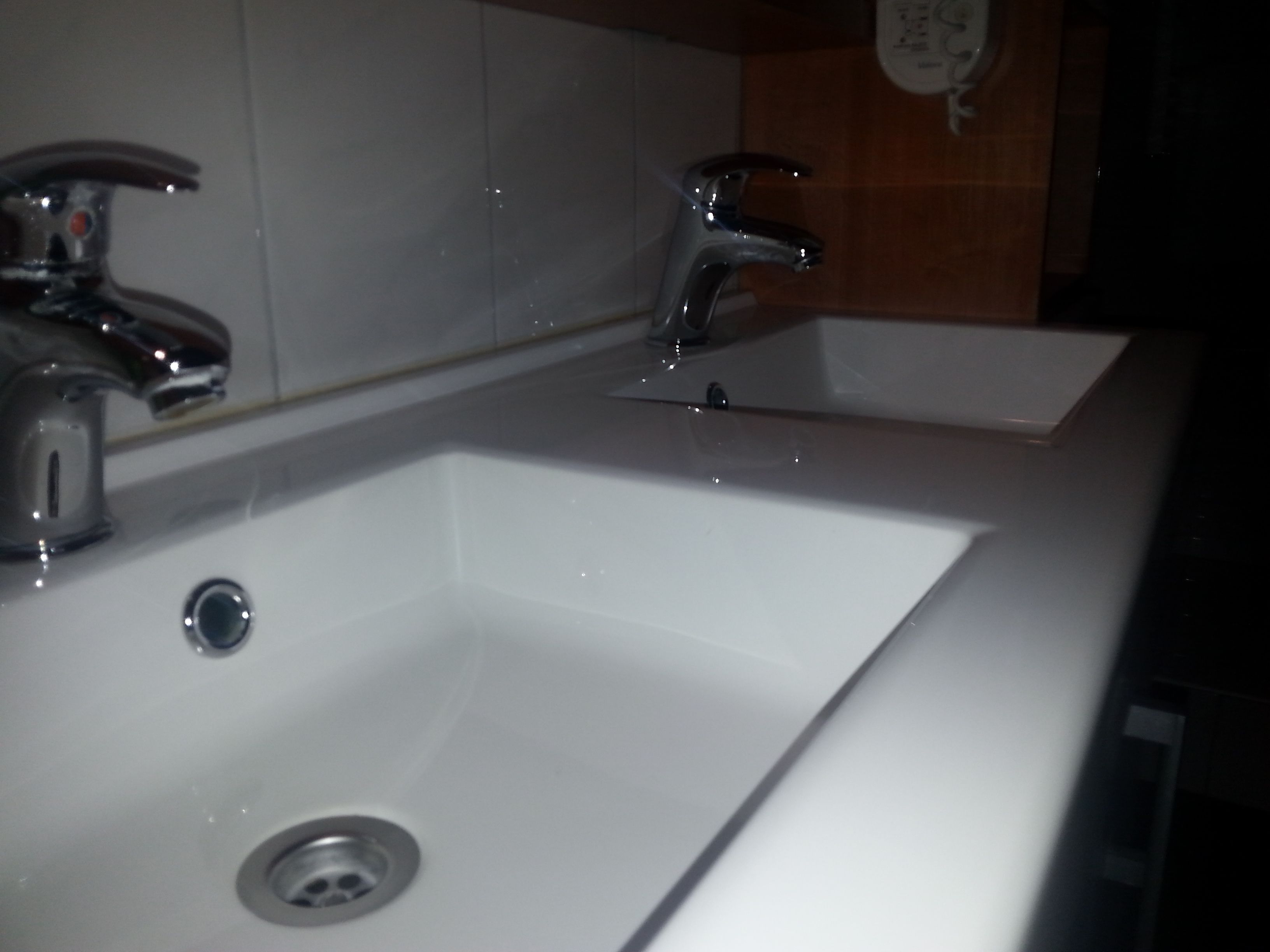 A bathroom sink with a mirror above it.