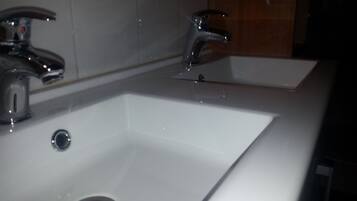 A bathroom sink with a mirror above it.