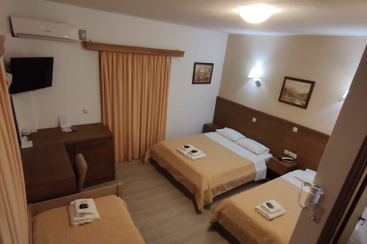 Quadruple Room, Partial Sea View | In-room safe, free WiFi, bed sheets