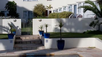 Outdoor pool, open 7:00 AM to 6:00 PM, pool umbrellas, sun loungers