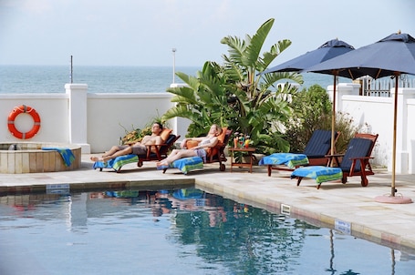 Outdoor pool, open 7:00 AM to 6:00 PM, pool umbrellas, sun loungers