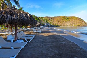 On the beach, sun loungers, beach umbrellas, beach towels