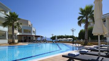 Outdoor pool, pool umbrellas, pool loungers