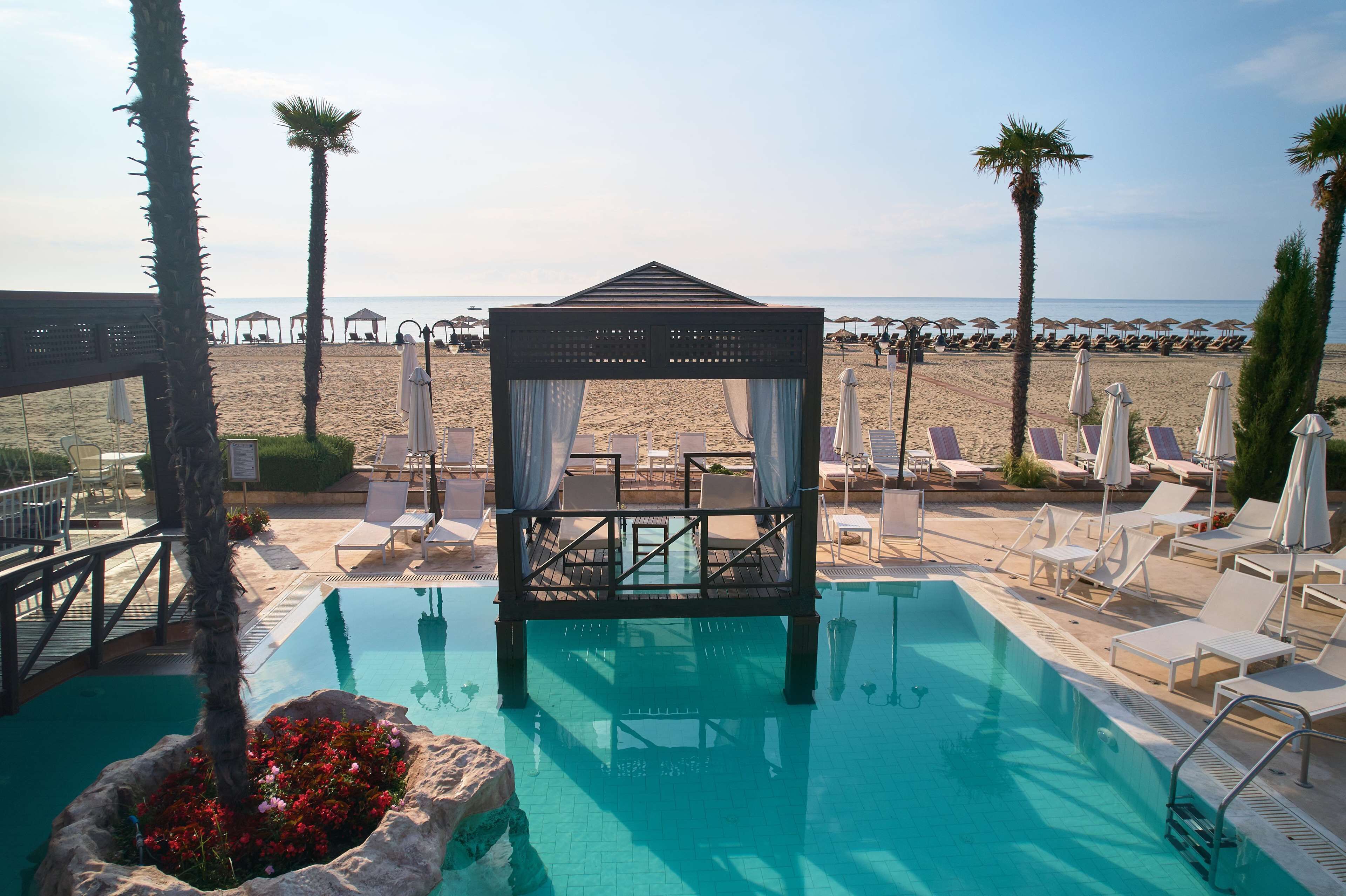 indoor pool, seasonal outdoor pool, pool umbrellas, pool loungers