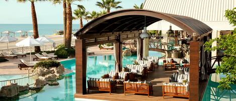Indoor pool, seasonal outdoor pool, pool umbrellas, pool loungers
