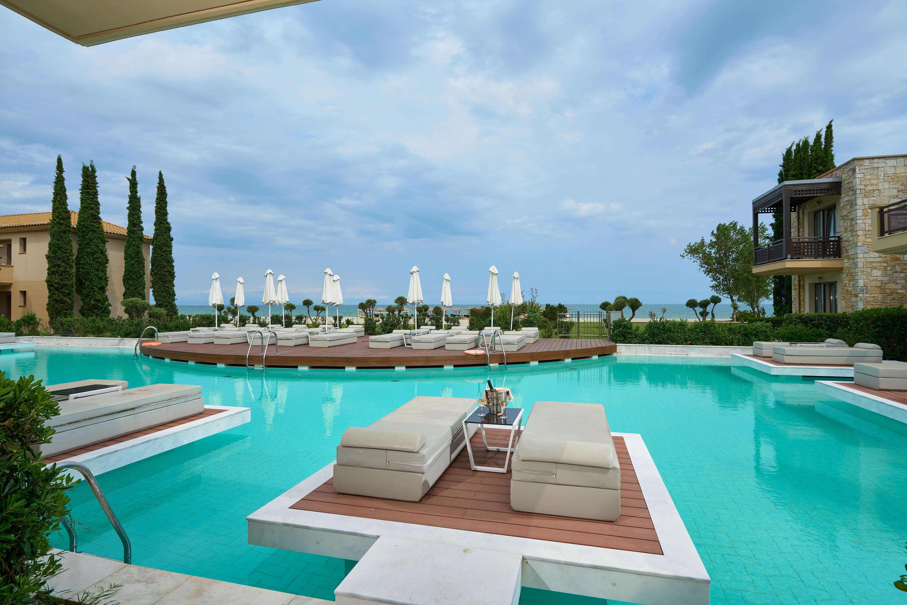 indoor pool, seasonal outdoor pool, pool umbrellas, pool loungers