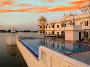 A traditional building with a pool, reflecting the sky. - juSTa Lake Nahargarh Palace - Chittorgarh (Begun)