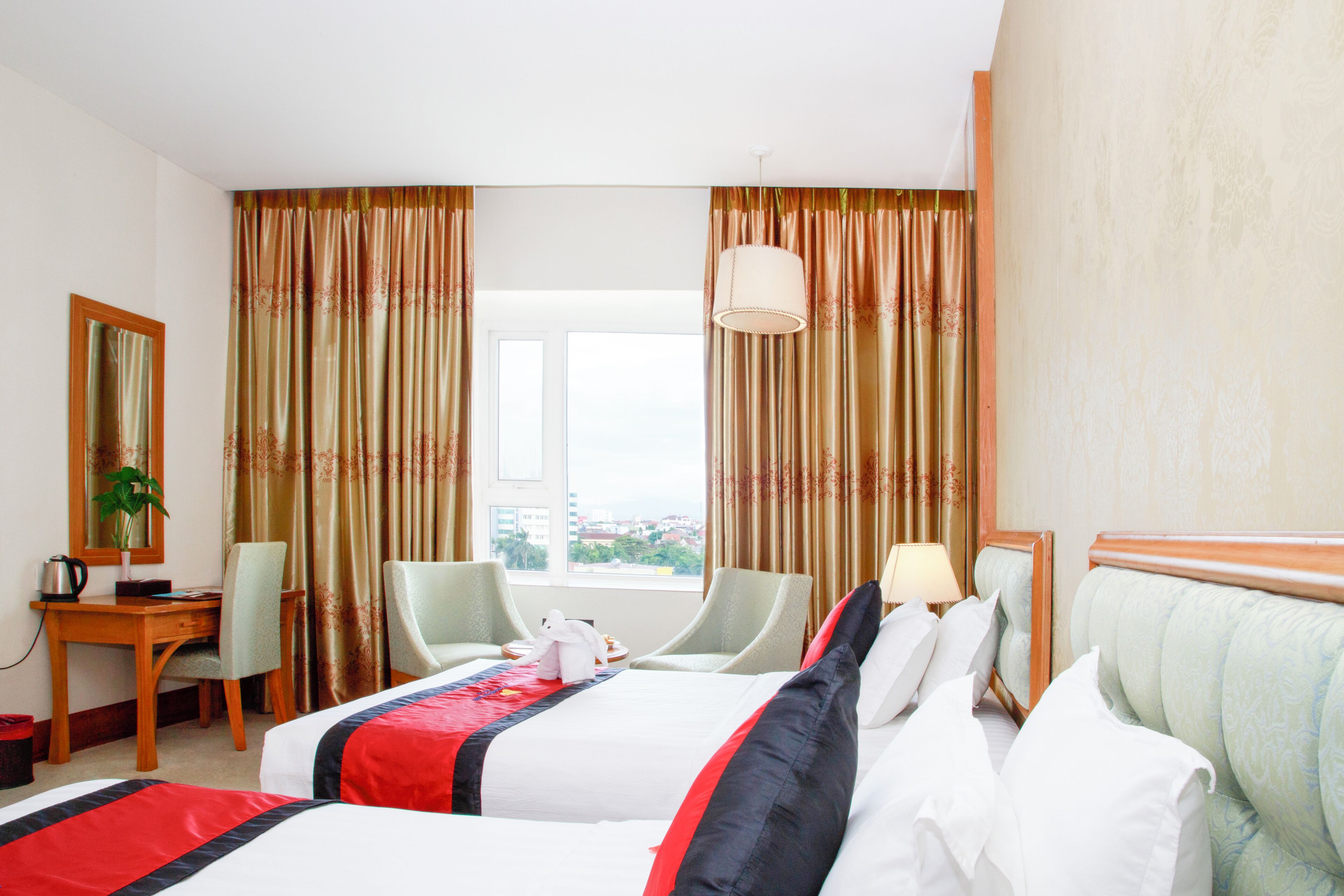 deluxe room, city view | minibar, in-room safe, desk, laptop workspace