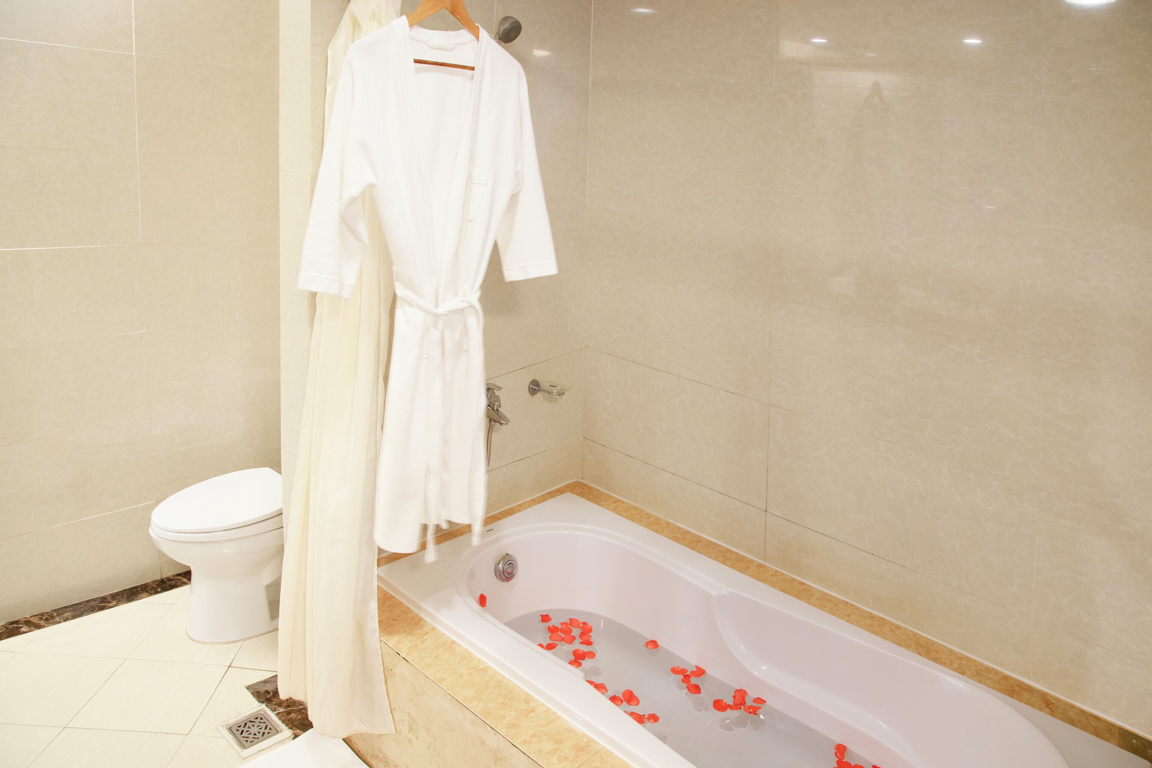 hair dryer, bathrobes, slippers, towels