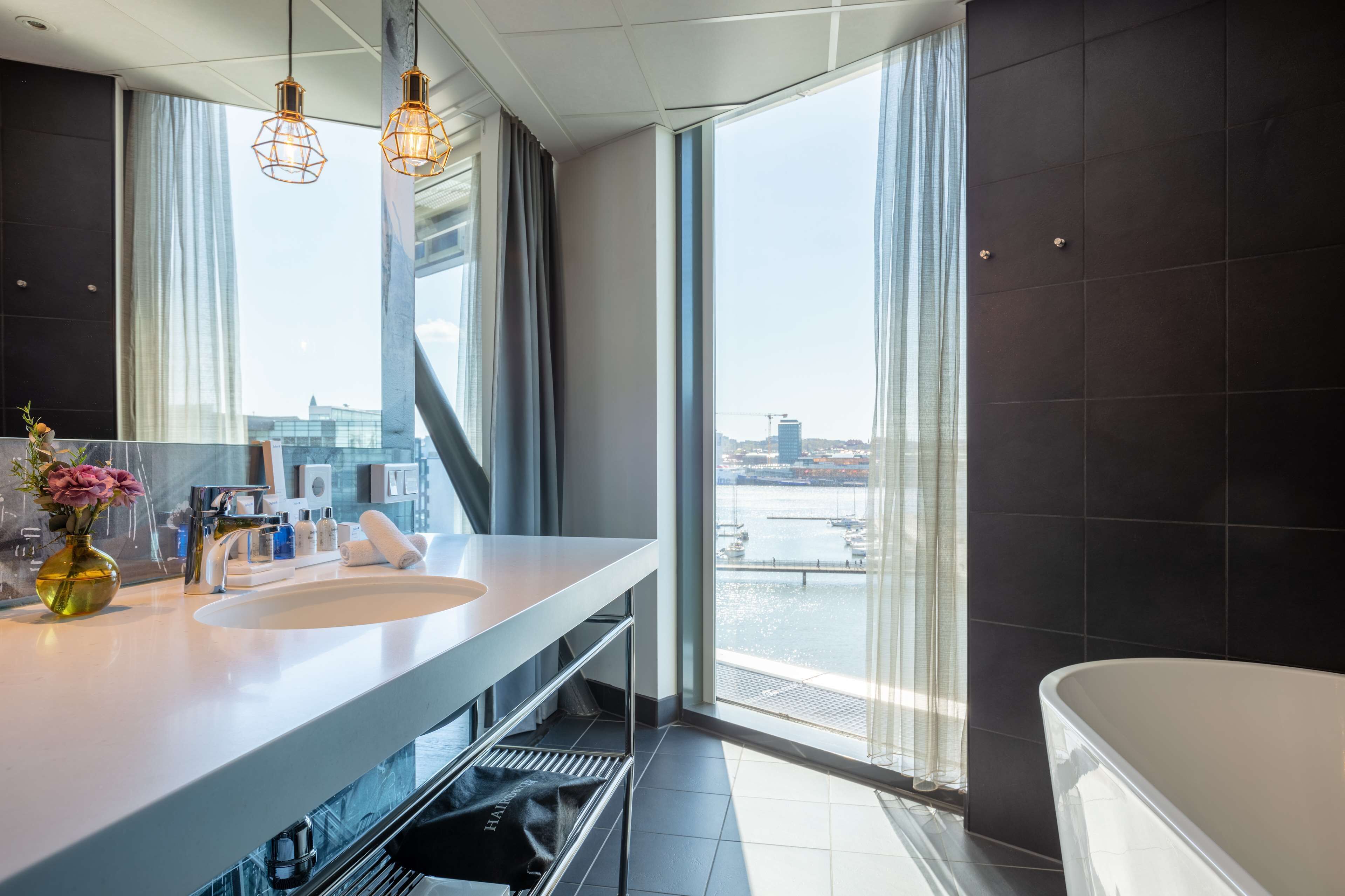 suite, 1 bedroom, river view | bathroom | shower, eco-friendly toiletries, hair dryer, towels