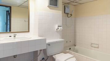 A bathroom with a sink, toilet, and bathtub.