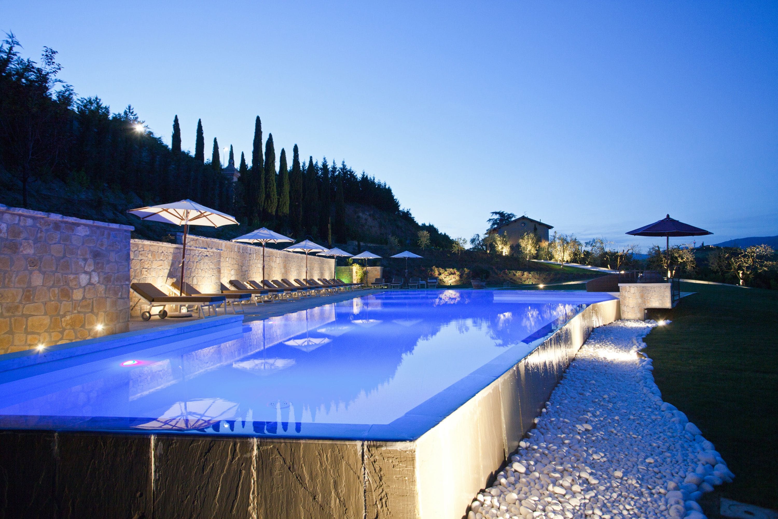 Outdoor pool, open 8:00 AM to 8:00 PM, pool umbrellas