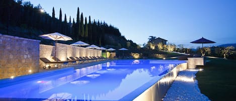 Outdoor pool, open 8:00 AM to 8:00 PM, pool umbrellas